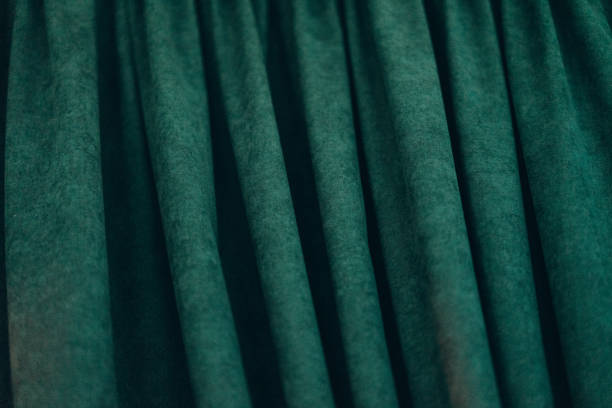 istock emerald luxury fabric background with copy space, drapery, selective focus, film and grain photo 1197101976