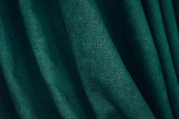 istock emerald luxury fabric background with copy space, drapery, selective focus, film and grain photo 1197101995