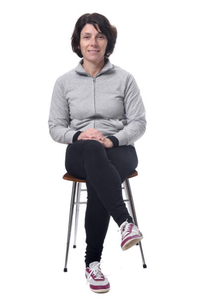 istock woman with a chair on white background 1197102175