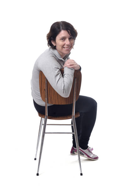 istock woman with a chair on white background 1197102222