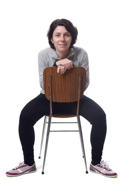 istock woman with a chair on white background 1197102253