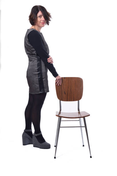 istock woman with chair on white background 1197102385