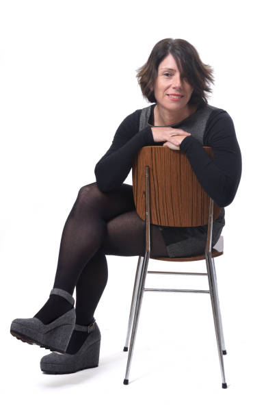 istock woman sitting on white background 1197102400