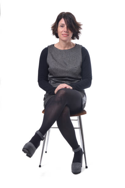 istock woman sitting on white background 1197102463