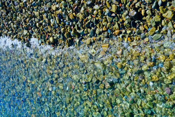 istock Calm Surf on Colorful Rocks 1197103023