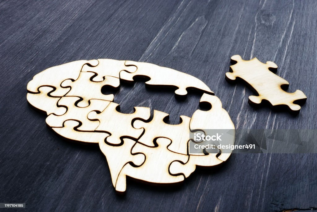 Brain from wooden puzzles. Mental Health and problems with memory. Memories Stock Photo