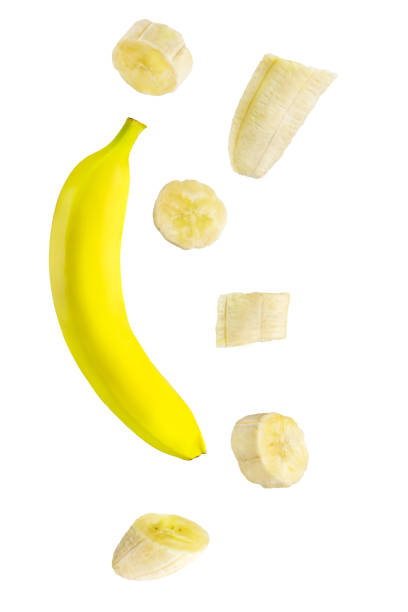 istock Isolated falling fruits. Falling banana fruit isolated on white background 1197105632