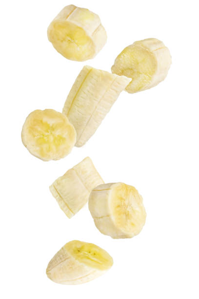 istock Isolated falling fruits. Falling banana fruit isolated on white background 1197105633