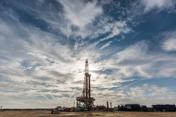 istock Oil drilling rig at sunset 1197105652