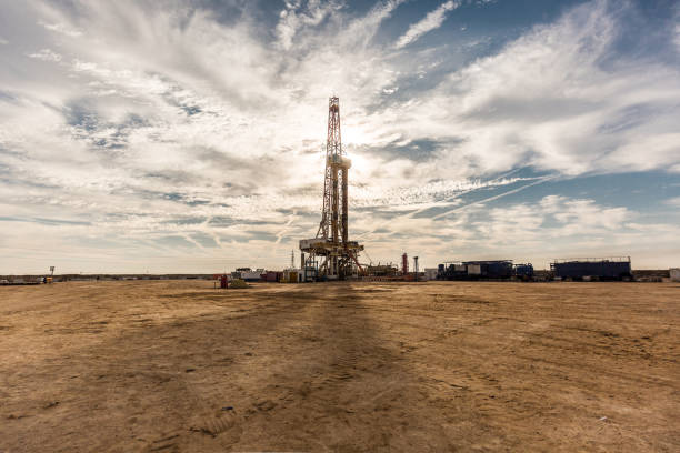 istock Oil drilling rig at sunset 1197105661