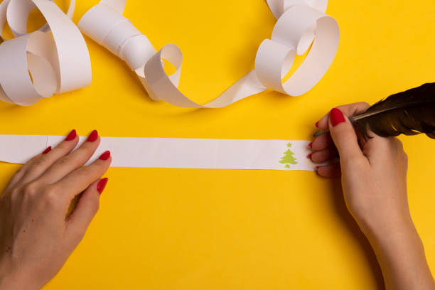 istock Long twisted expanded empty letter. Copy space. yellow background. View from above. 1197106932