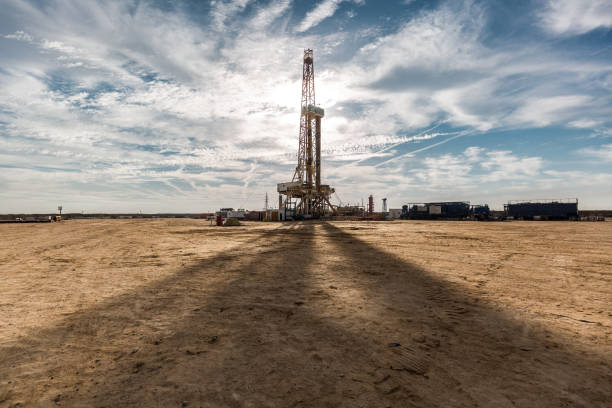 istock Oil drilling rig at sunset 1197106962