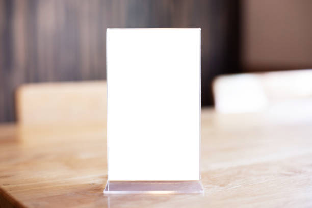 istock Mock up Menu frame standing on wood table in Bar restaurant cafe. space for text 1197107416