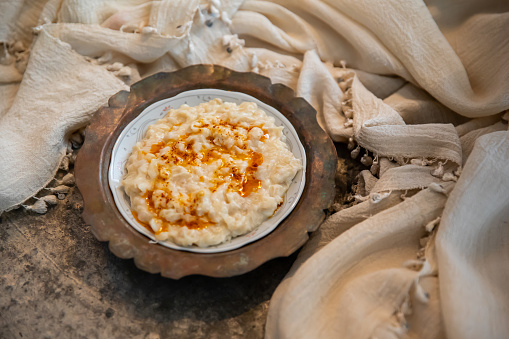 Keskek is a traditional food  of Turkish cousine, it made with wheat, meat and fried butter sauce.