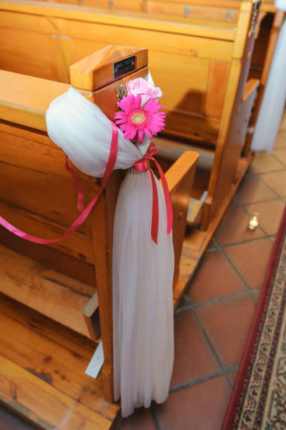 istock Church sanctuary before a wedding ceremony. Empty chairs for bride and groom. 1197109869