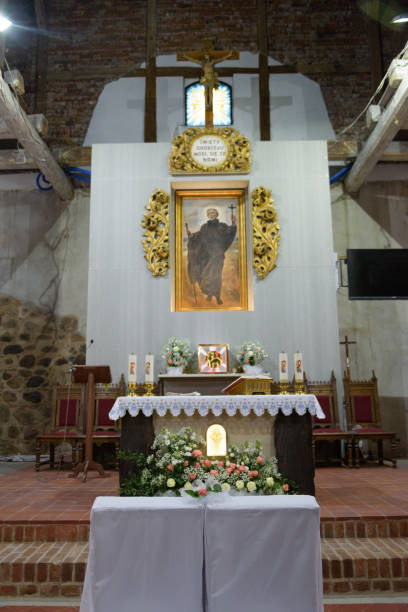 istock Church sanctuary before a wedding ceremony. Empty chairs for bride and groom. 1197109902