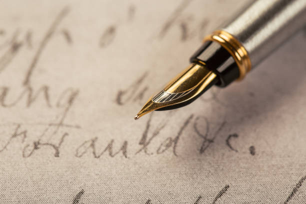 istock Fountain pen on an ancient handwritten letter. Old story. Retro style. 1197110837