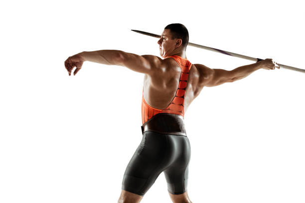 istock Male athlete practicing in throwing javelin isolated on white studio background 1197113175
