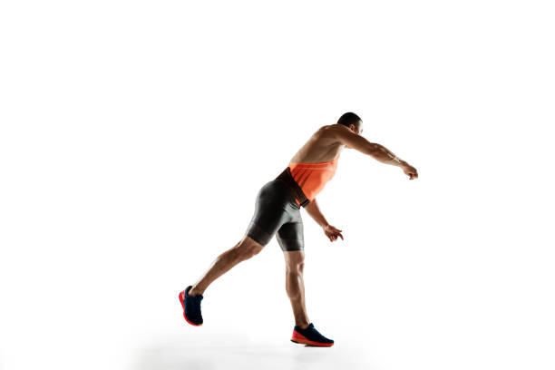 istock Male athlete practicing in throwing javelin isolated on white studio background 1197113200