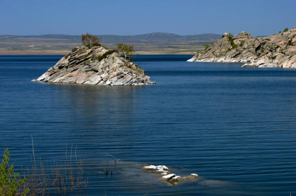 istock Stone island on the lake. 1197113502
