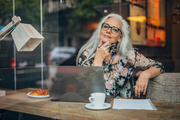 istock Pretty senior woman working on laptop 1197113985