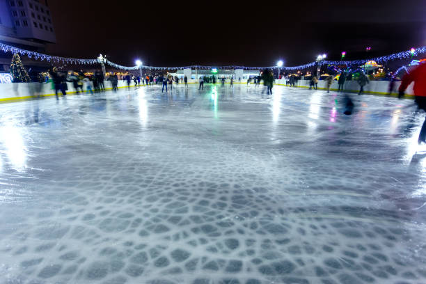 istock people ride on a night skating rink, long exposure 1197114552