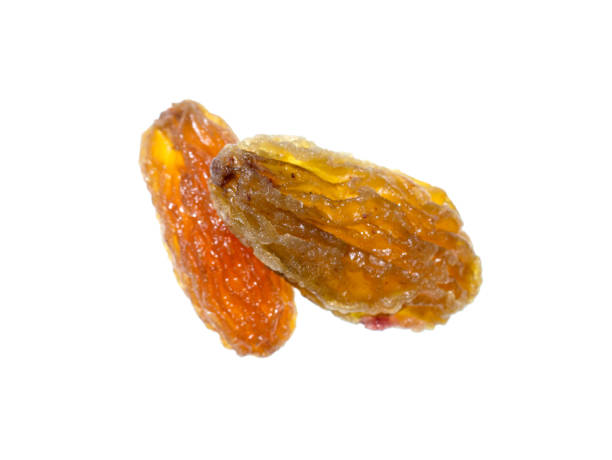 istock Close up of dried raisin on white background 1197114776