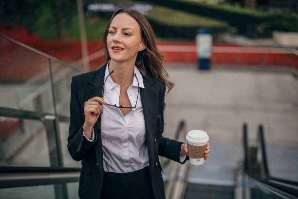 istock Young woman with coffee cup 1197115153