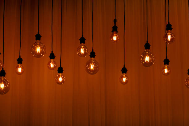 istock Vintage lights bulb retro style. background for screensaver. 1197118496