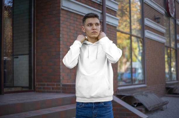 istock Template of a white hoodie on a young guy, front view. 1197120674