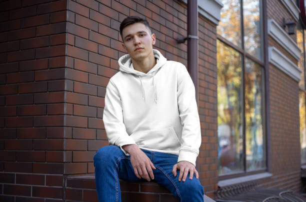 istock Template of a white hoodie on a young guy, front view. 1197120806
