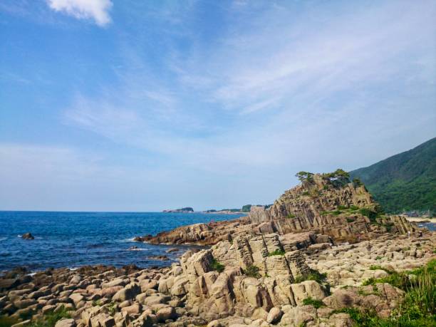 istock Mysterious coastal scenery with Japanese columnar joint rocks 1197121573