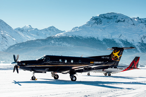 St. Moritz, Switzerland - December 31, 2017: An Air Corviglia Pilatus PC-12 on the snow parking at St. Moritz.