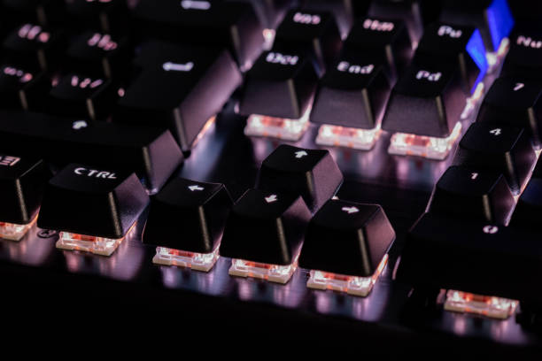 istock a close-up view of black mechanical pc keyboard with white backlight 1197123357