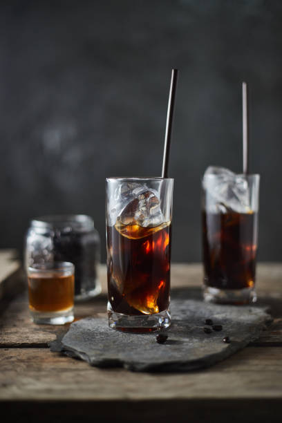 istock Ice coffee in a tall glass on wooden table. 1197123371