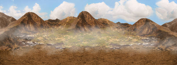 istock Mountains under blue sky with thick clouds and green meadow valley with fog. Header nature banner. View from a cliff on highland terrain 1197124219