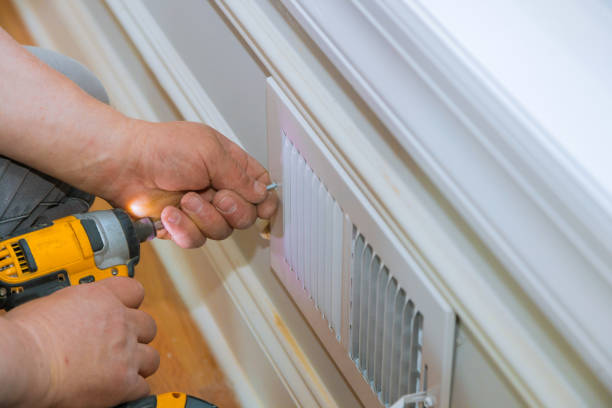 istock Maintenance repair, man is making the wall vent cover 1197124522