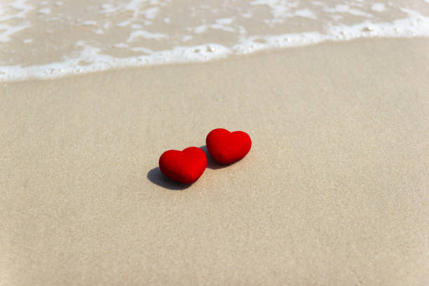 istock Red heart on a sandy beach. concept Valentine day 1197134491