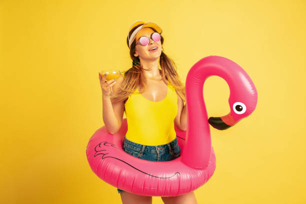 istock Caucasian woman's portrait isolated on yellow studio background 1197135102