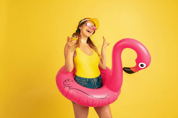 istock Caucasian woman's portrait isolated on yellow studio background 1197135103