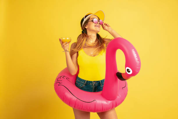istock Caucasian woman's portrait isolated on yellow studio background 1197135104