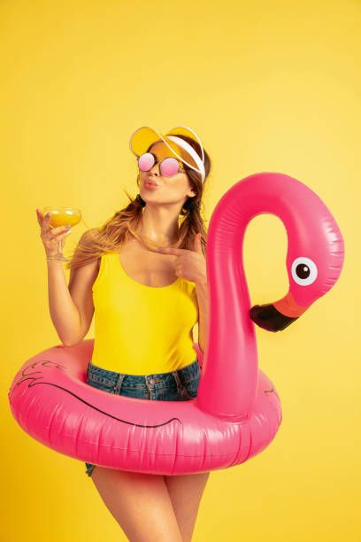 istock Caucasian woman's portrait isolated on yellow studio background 1197135485