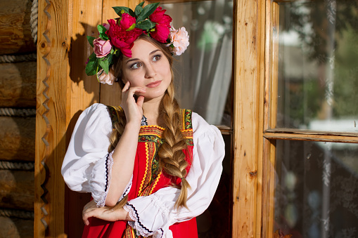 Beautiful woman portrait in russian style. Beautiful Russian girl in traditional dress. Russian style.