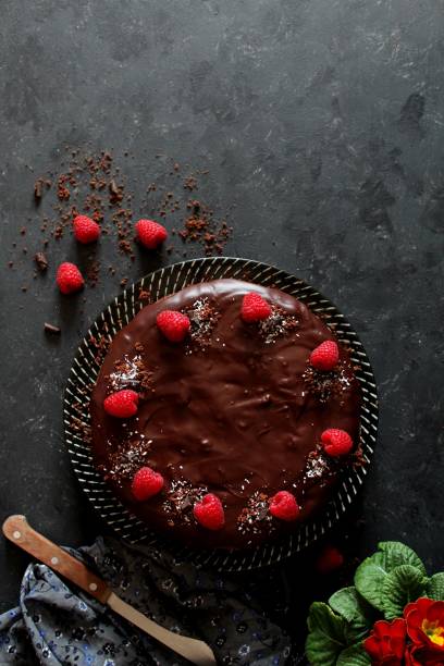 istock Chocolate cake with fruits on stone background. 1197136847