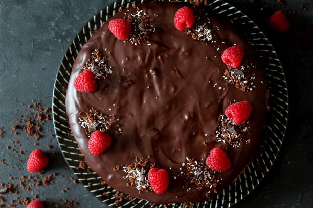 istock Chocolate cake with fruits on stone background. 1197136853