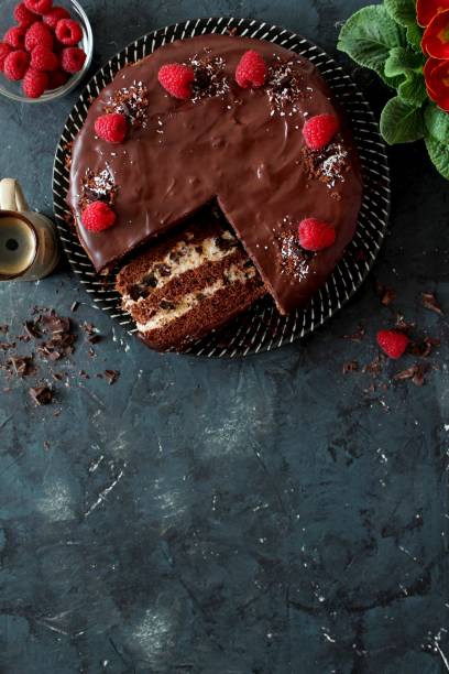 istock Chocolate cake with fruits on stone background. 1197136923