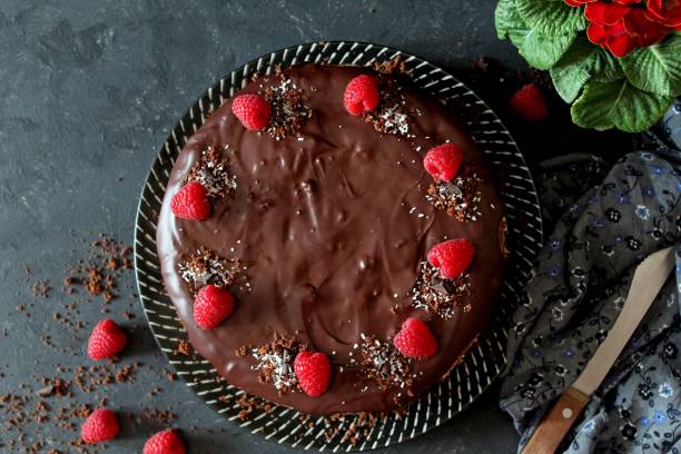 istock Chocolate cake with fruits on stone background. 1197137158