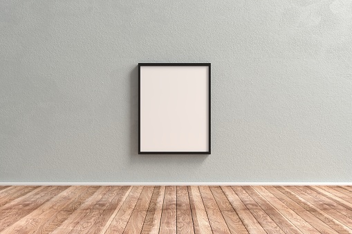 Plain Empty Picture Frame on wooden surface reserved for copyspace concepts.
