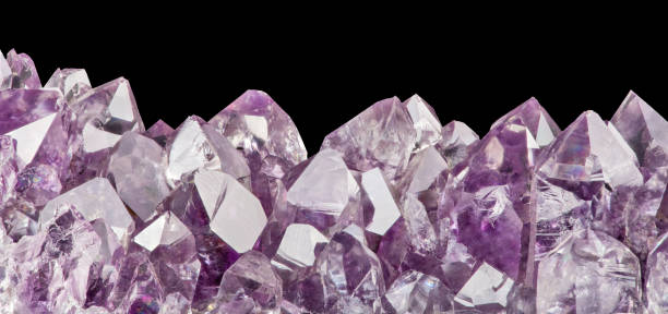 istock light amethyst crystals macro isolated on black 1197138719