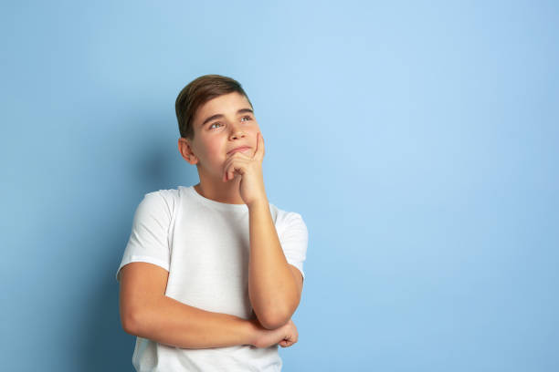 istock Caucasian teen's portrait isolated on blue studio background 1197139474